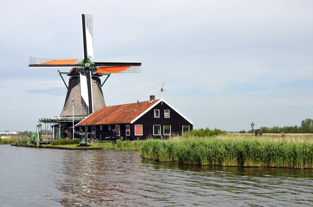 A Dutch windmill beside the water