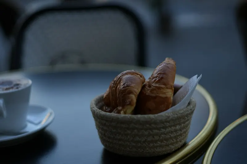Croissants and coffee on a café table